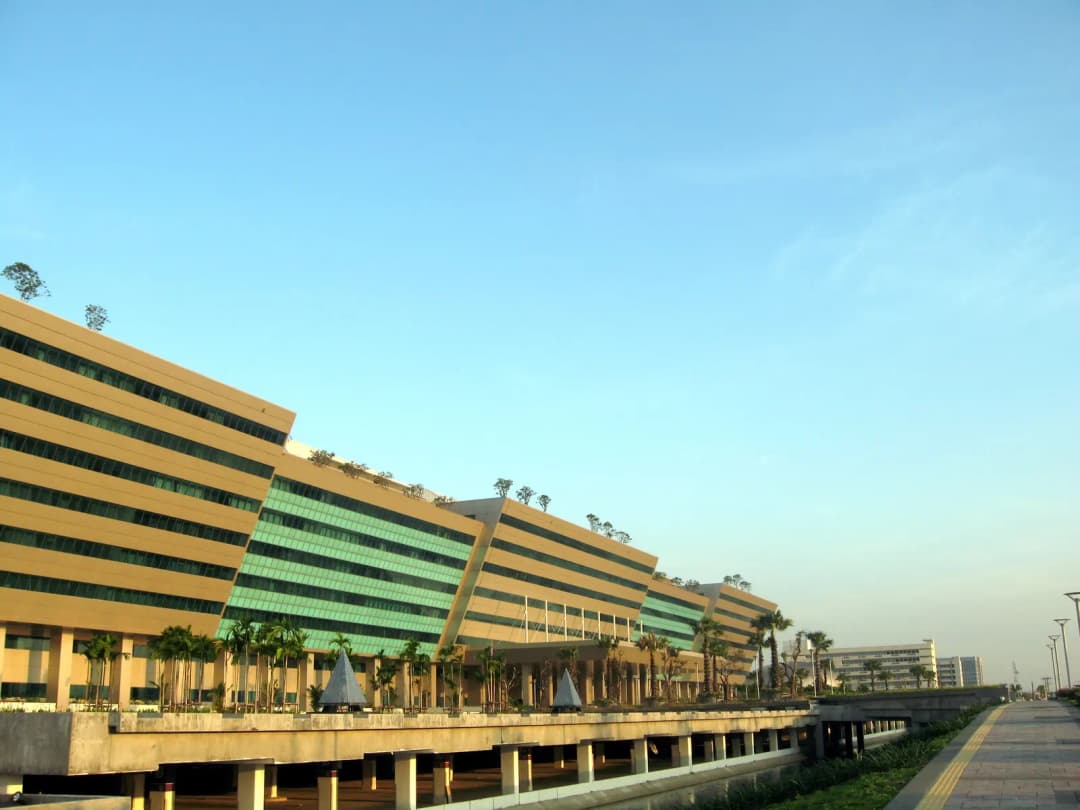 Long striped facade of the Government Complex on Chaeng Watthana Road, Bangkok